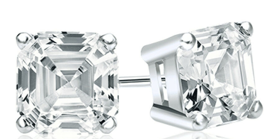 A pair of emerald cut stud earrings.