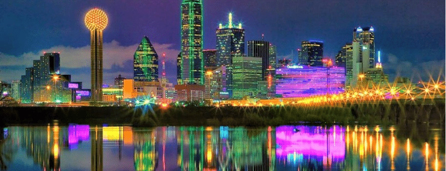 A city skyline reflected in a body of water.