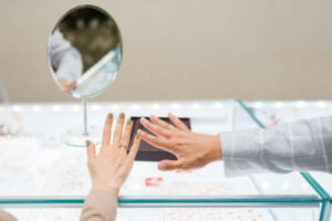 couple choosing ring together at jewelry store