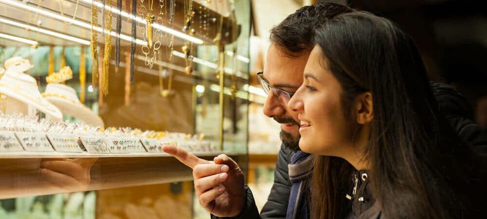 Couple window shopping diamonds and jewelries - Shira Diamonds