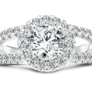 An oval diamond halo engagement ring in white gold.