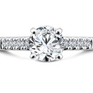 A white gold engagement ring with an oval cut diamond.