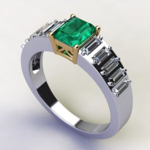 An emerald and diamond ring.